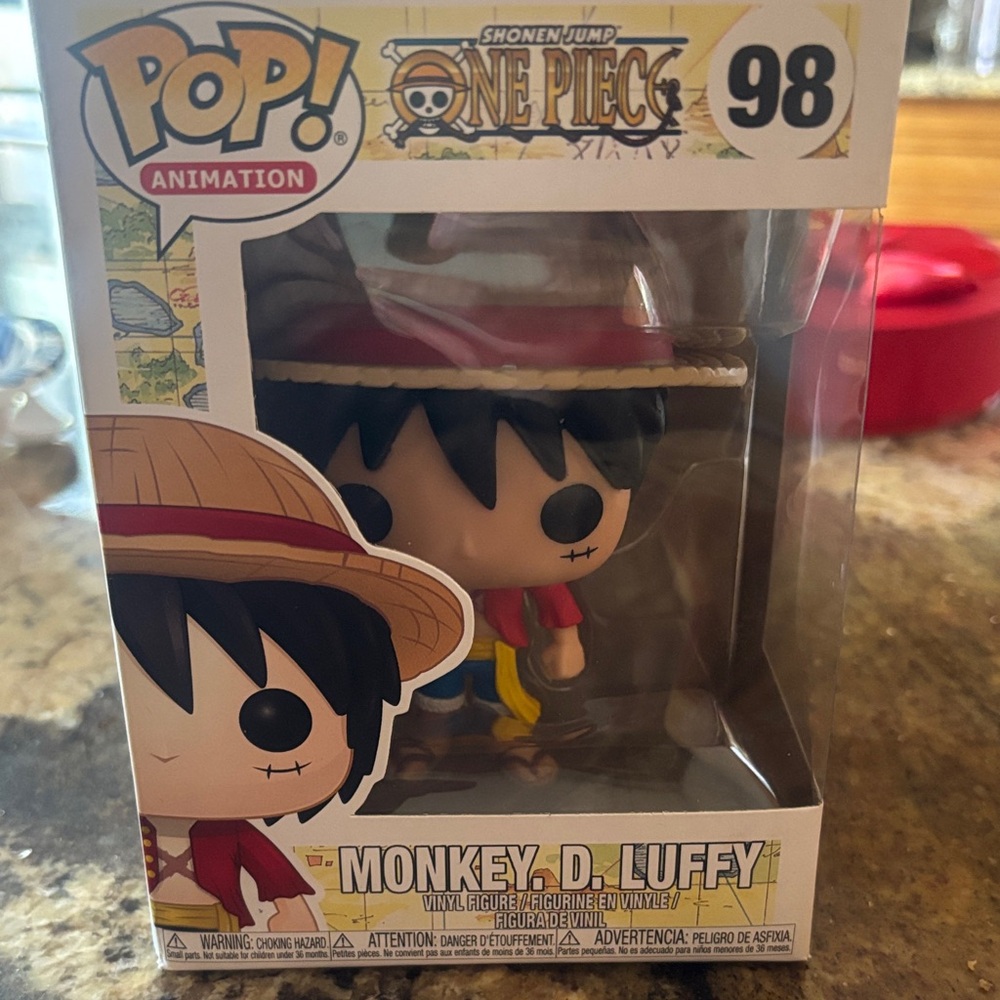 Pop Animation Figure with Red Hat and Blue Outfit